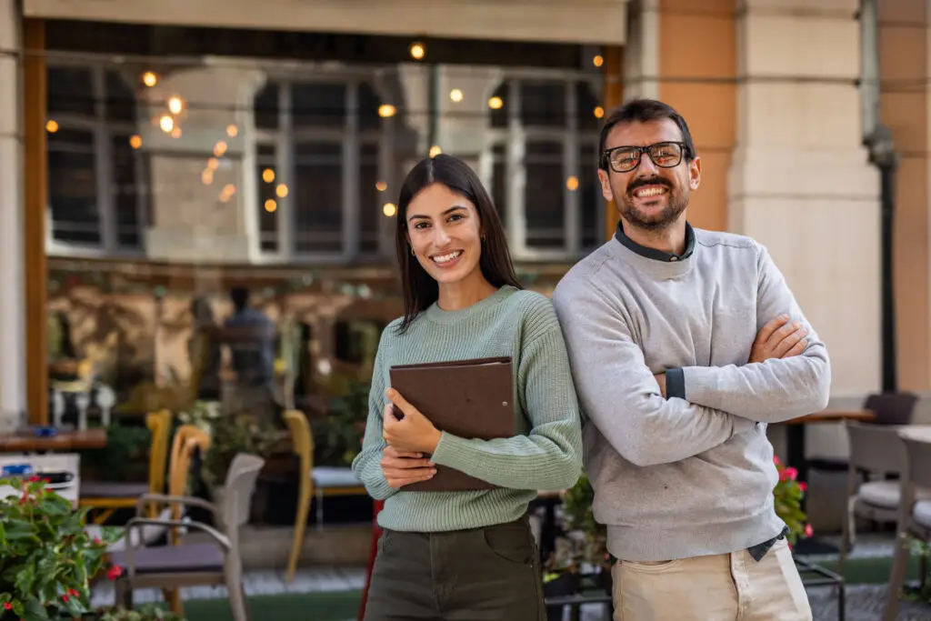 Small business owners outside their New York restaurant